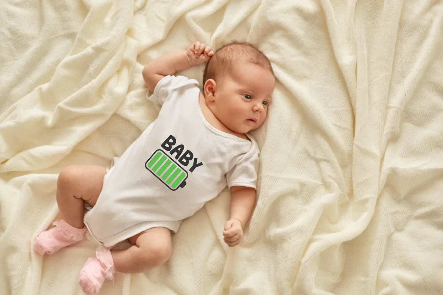 newborn-baby-girl-boy-lying-blanket-bed-looking-away-wearing-white-bodysuit-socks-infant-studying-world-around-has-sleepy-expression