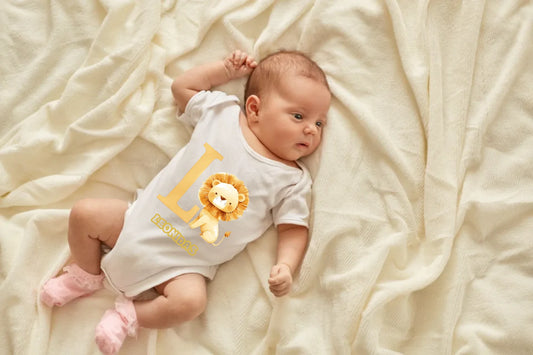 newborn-baby-girl-boy-lying-blanket-bed-looking-away-wearing-white-bodysuit-socks-infant-studying-world-around-has-sleepy-expression