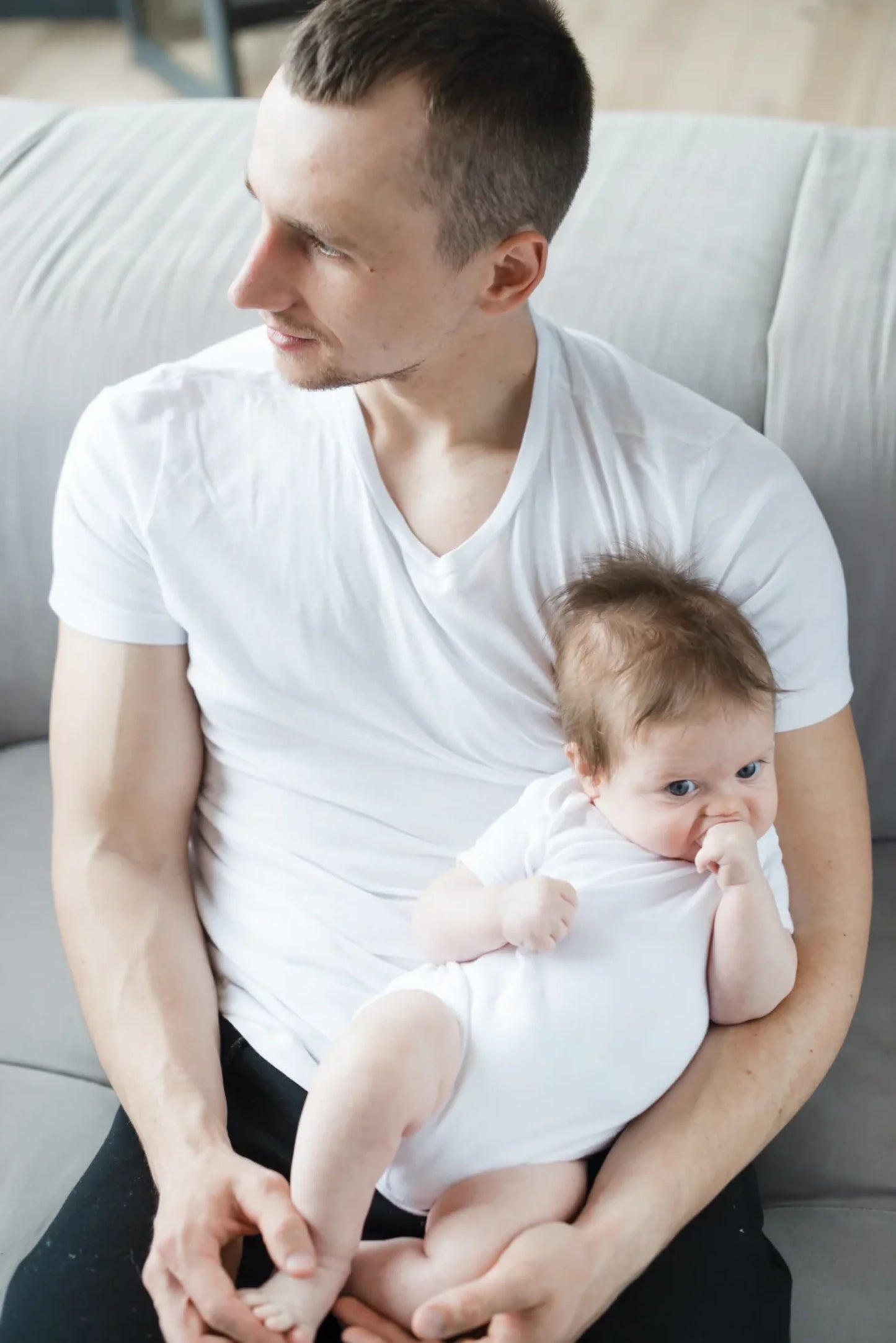 young-man-with-toddler-sofa
