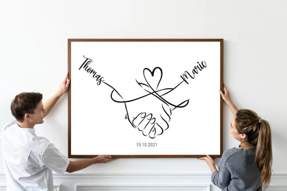oster mit minimalistischer Zeichnung zweier Hände, die sich halten. Darüber eine geschwungene Linie in Herzform, links und rechts personalisierbare Namen. Unten Platz für ein Datum, hier als Beispiel 15.10.2021.